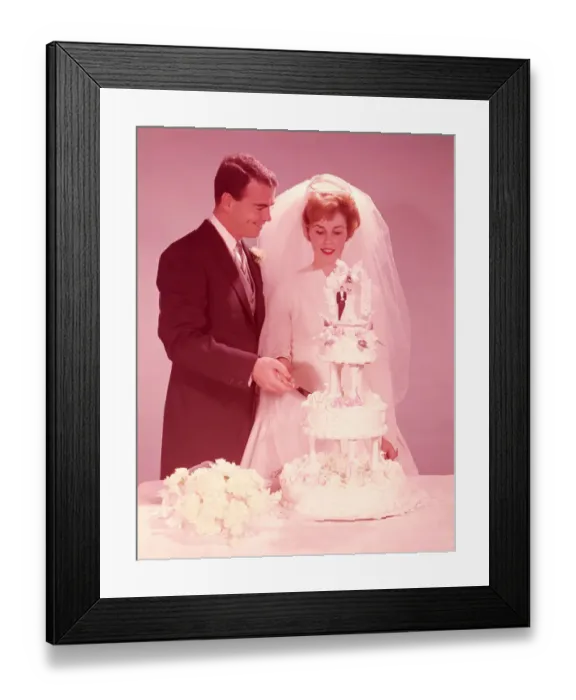 Framed Print : Bride and groom cutting the wedding cake. (Photo by H. Armstrong Roberts / Retrofile / Getty Framed Print : Bride and groom cutting the wedding cake. (Photo by H. Armstrong Roberts / Retrofile / Getty