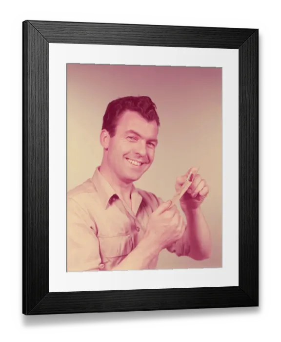 Framed Print : Man smiling, opening pay day envelope