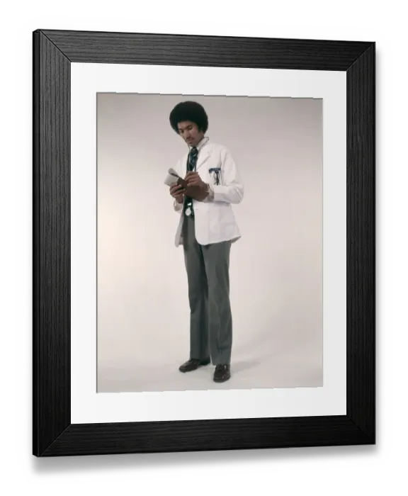 Framed Print : African-American Man Doctor Wearing White Coat And Stethoscope Writing Prescriptions