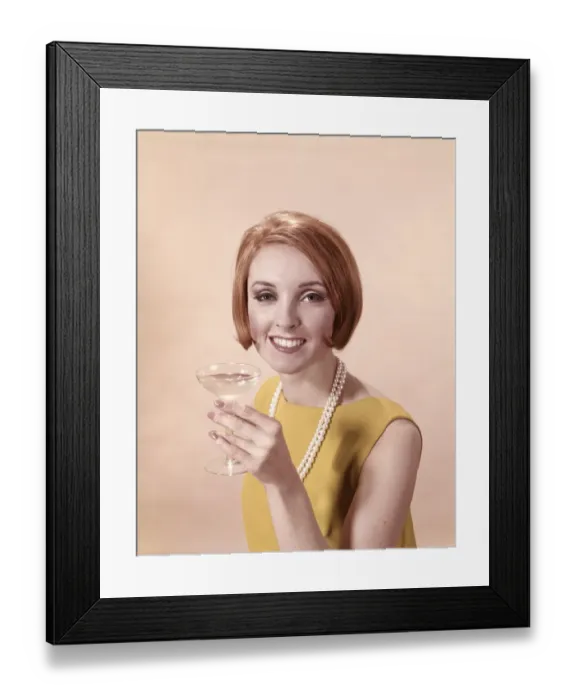 Framed Print : Portrait of glamorous woman in pearls holding cocktail Framed Print : Portrait of glamorous woman in pearls holding cocktail