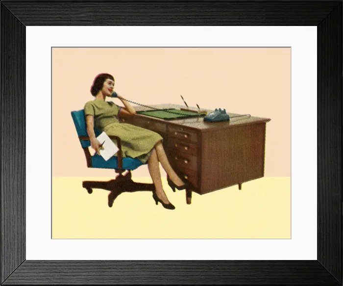 Framed Print : Woman Sitting at Desk Talking on Phone Framed Print : Woman Sitting at Desk Talking on Phone