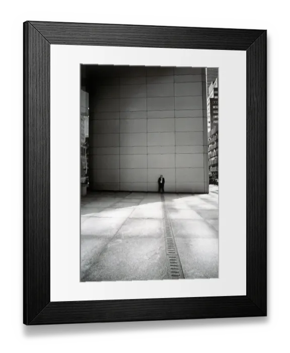 Framed Print : Businessman leaning against wall Framed Print : Businessman leaning against wall