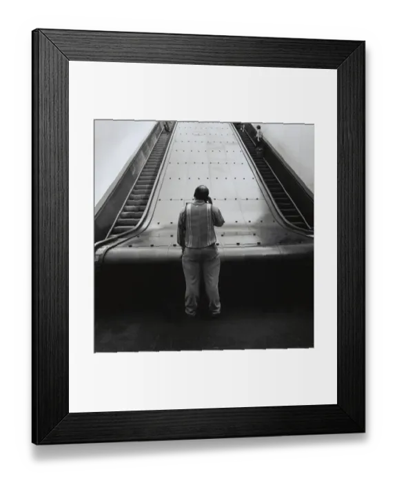 Framed Print : Man at bottom of Path train escalators in New York City Framed Print : Man at bottom of Path train escalators in New York City