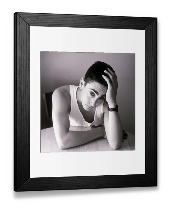 Framed Print : Teenager sitting at table Framed Print : Teenager sitting at table
