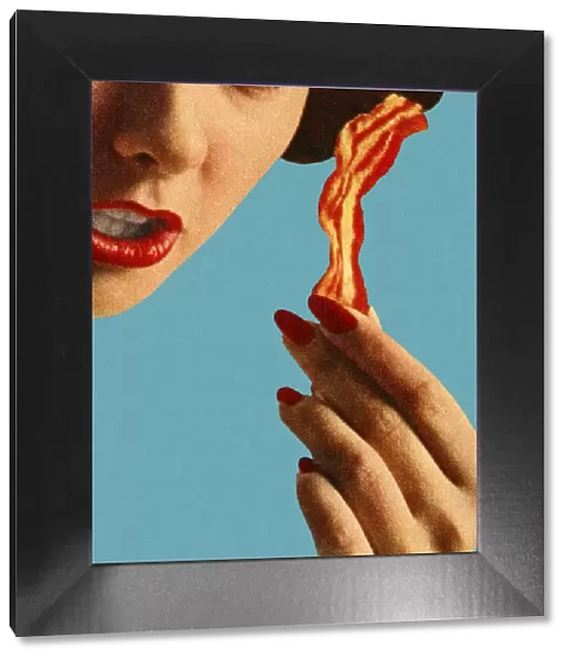 Woman Holding a Piece of Bacon