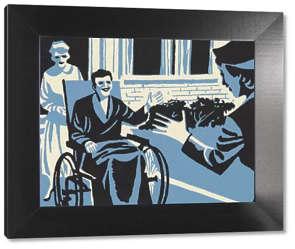 Woman Visiting a Man in a Wheelchair