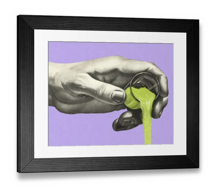 Framed Print : Hand Pouring a Green Liquid