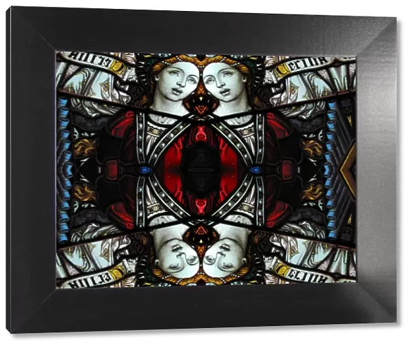 Abstract image: kaleidoscopic image of a colored stained glass window inside a church