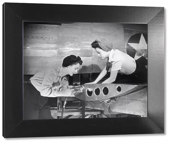 Female workers working on plane