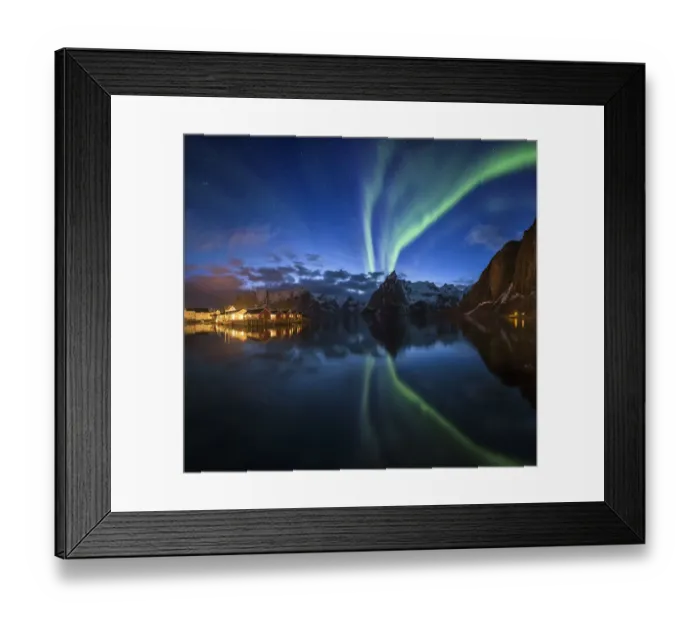 Framed Print : Northern lights over fishing village with mountain range on coastline at Hamnoy Framed Print : Northern lights over fishing village with mountain range on coastline at Hamnoy