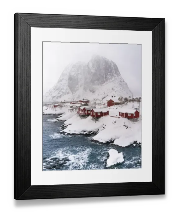 Framed Print : Snowstorm, red stilt houses, Hamnoy, drone shot, Lofoten, Norway