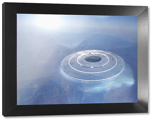 Circular UFO flying over mountain landscape