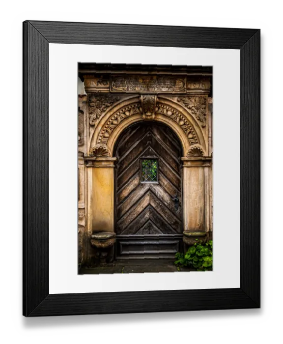 Framed Print : An old carved wooden door with an ornate frame with latin inscriptions Framed Print : An old carved wooden door with an ornate frame with latin inscriptions