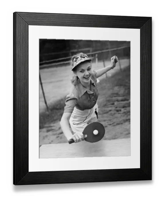 Framed Print : Woman playing table tennis, (B&W) Framed Print : Woman playing table tennis, (B&W)