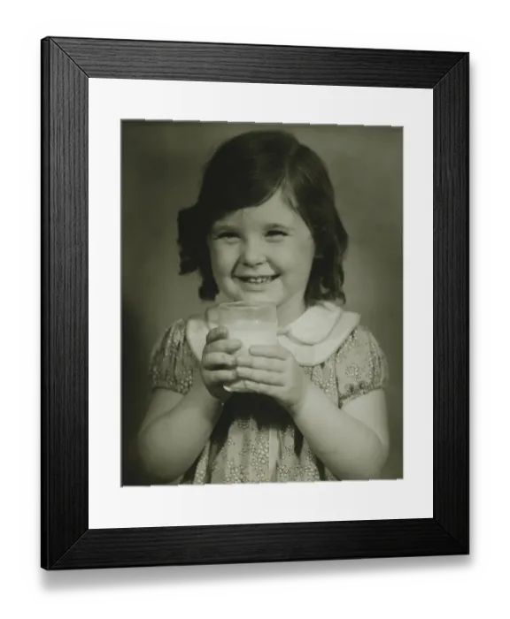 Framed Print : Girl (4-5) holding glass of milk, (B&W), portrait Framed Print : Girl (4-5) holding glass of milk, (B&W), portrait