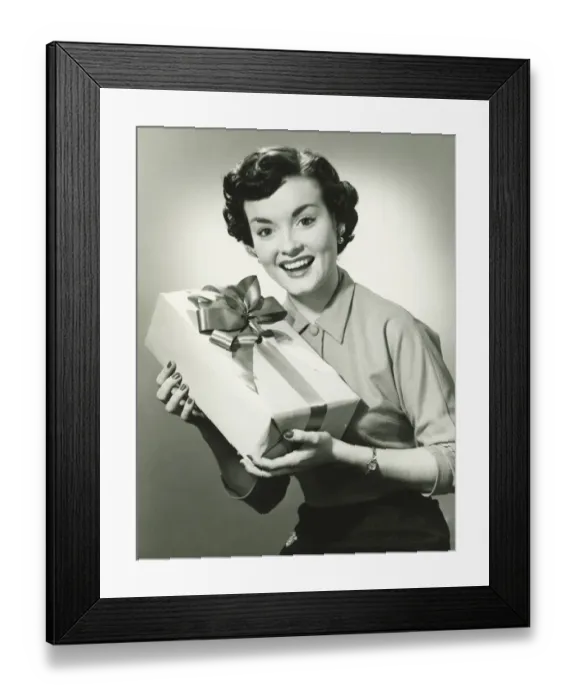 Framed Print : Young woman holding present, (B&W), portrait Framed Print : Young woman holding present, (B&W), portrait