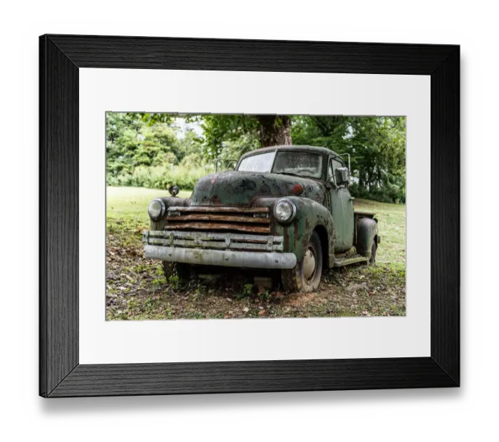 Framed Print : Weathered vintage truck abandoned in field close-up
