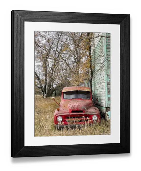 Framed Print : A vintage red pick-up truck parked beside an abandoned house Framed Print : A vintage red pick-up truck parked beside an abandoned house