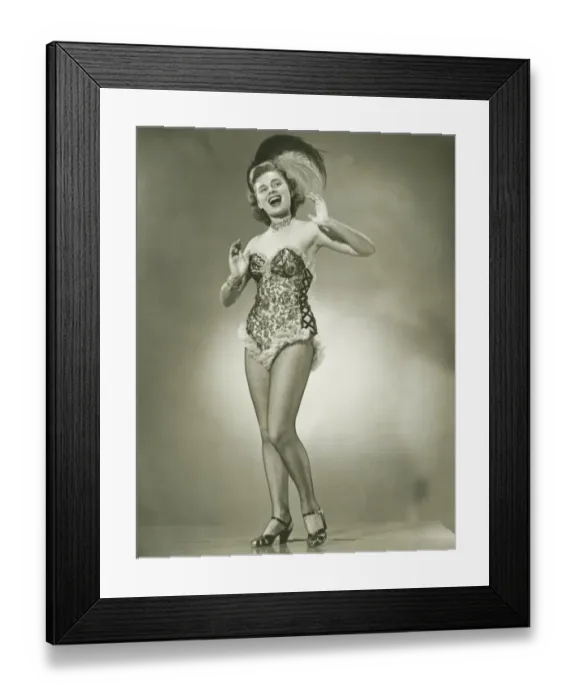 Framed Print : Young woman singing, posing in studio, (B&W) Framed Print : Young woman singing, posing in studio, (B&W)