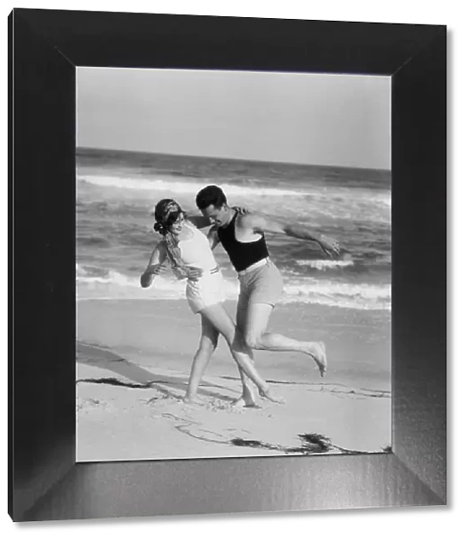 Couple embracing on sandy beach