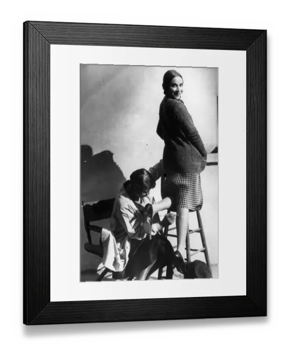 Framed Print : Leg Seams. 1926: A woman having a seam painted onto her leg Framed Print : Leg Seams. 1926: A woman having a seam painted onto her leg