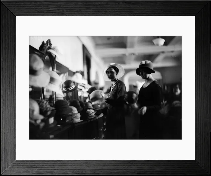 Framed Print : A New Hat. circa 1928: Shopping for hats in a department store Framed Print : A New Hat. circa 1928: Shopping for hats in a department store