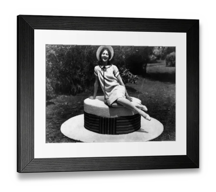 Framed Print : Giant Hat. 1927: A woman sitting on the worlds biggest straw hat Framed Print : Giant Hat. 1927: A woman sitting on the worlds biggest straw hat