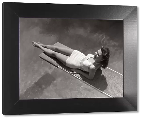 Woman Lying On Diving Board Over Pool Sunbathing Two Piece Bathing Suit Summer
