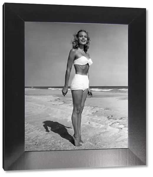 Woman in bikini standing on beach
