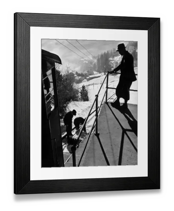 Framed Print : Checking The Cable