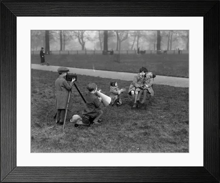 Framed Print : Film Kids. February 1928: Child cinematographers in Hyde Park producing a love scene Framed Print : Film Kids. February 1928: Child cinematographers in Hyde Park producing a love scene