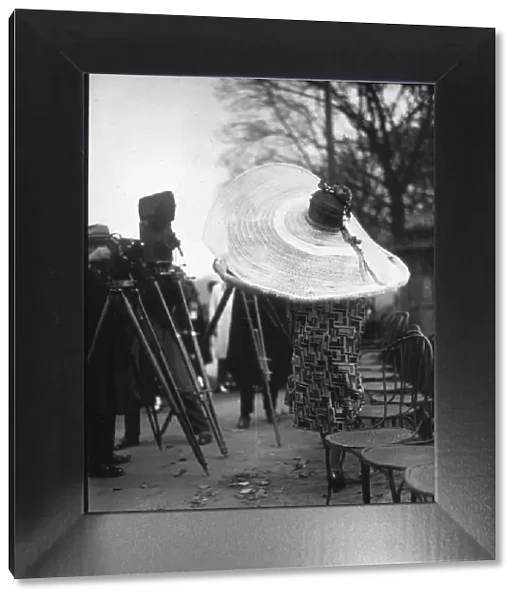 Big Hat. A woman models an extremely large hat. (Photo by Seeberger Freres / Getty Images)