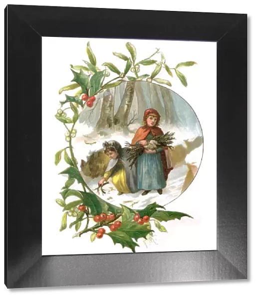 Holly and mistletoe frame with two Victorian girls collecting firewood