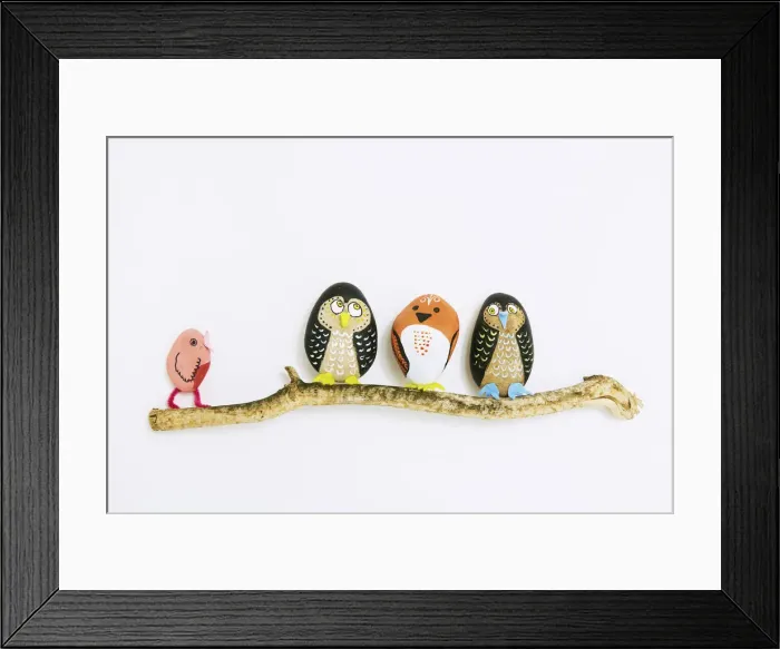 Framed Print : Decorated painted stone birds perching on a branch Framed Print : Decorated painted stone birds perching on a branch