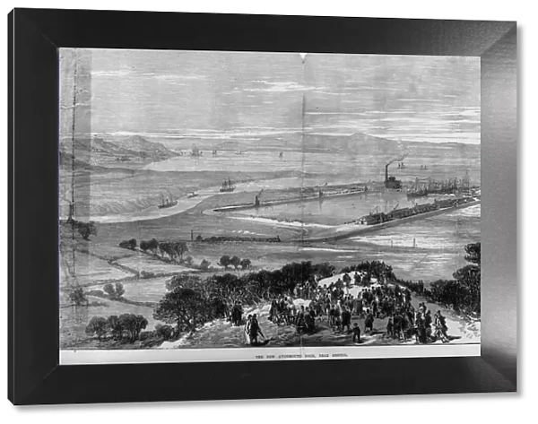 New Dock. March 1877: Crowds on a hilltop are viewing the new dock at Avonmouth