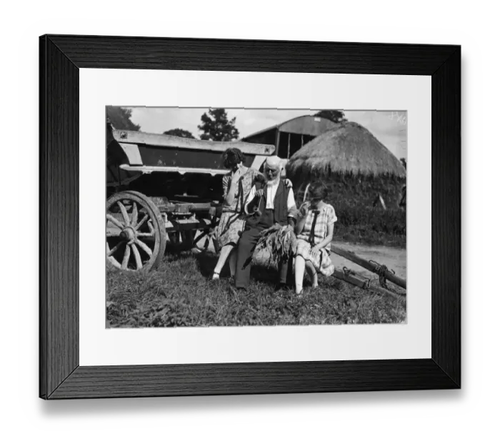 Framed Print : Rustic. September 1926: A farm worker relaxes with a pipe Framed Print : Rustic. September 1926: A farm worker relaxes with a pipe
