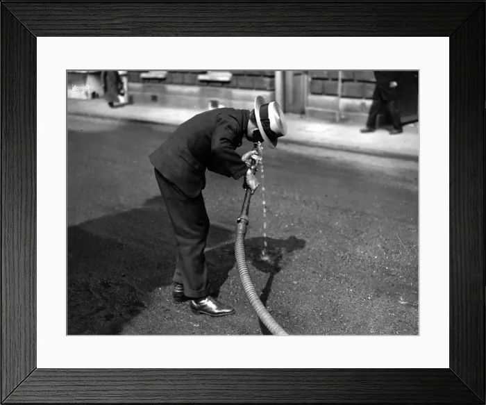 Framed Print : Thirsty. 5th June 1925: An office boy drinking Framed Print : Thirsty. 5th June 1925: An office boy drinking