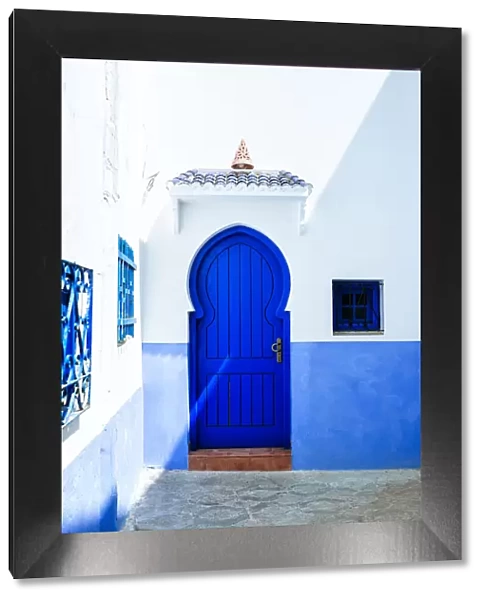 Typical blue house door in Chefchaouen, Morocco