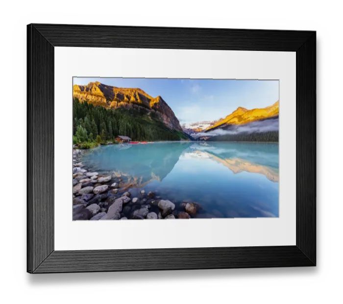 Framed Print : Lake Louise at sunrise, calm water and light on the mountain tops. Banff, Alberta, Canada