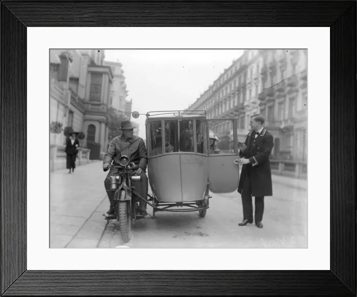 Framed Print : Sidecar. circa 1926: A young woman alights from an enclosed motorcycle sidecar Framed Print : Sidecar. circa 1926: A young woman alights from an enclosed motorcycle sidecar