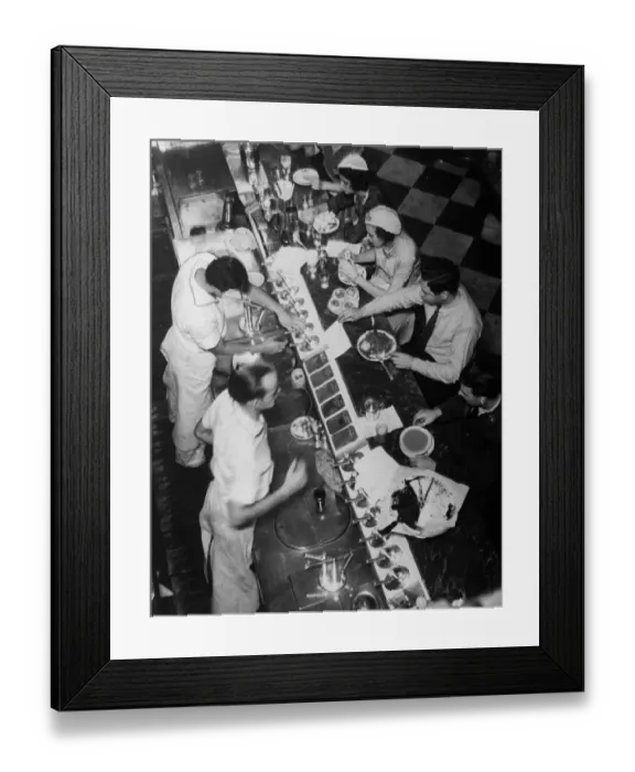 Framed Print : Fast Food. circa 1930: Americans eating lunch at a drug store soda fountain Framed Print : Fast Food. circa 1930: Americans eating lunch at a drug store soda fountain