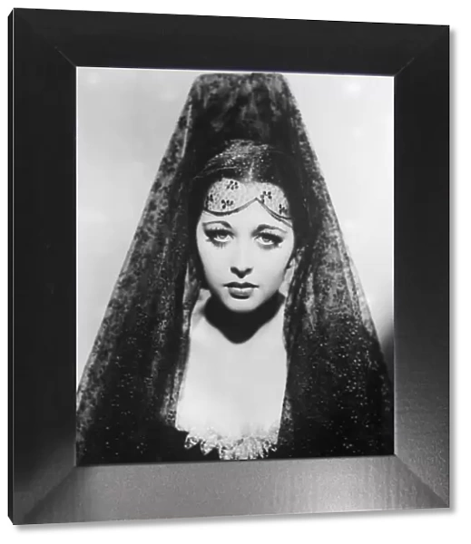 Mantilla. circa 1930: A woman wearing a traditional Spanish headress, known as a mantilla