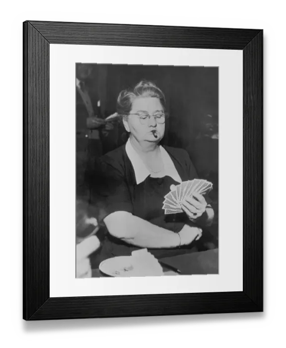 Framed Print : Mature woman playing cards, smoking cigar (B&W) Framed Print : Mature woman playing cards, smoking cigar (B&W)