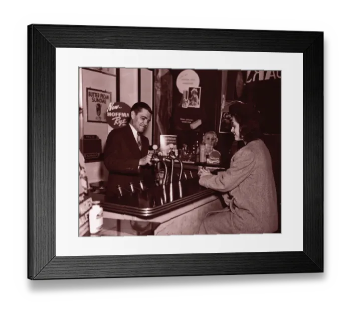Framed Print : Man serving woman at soda fountain (B&W sepia tone)