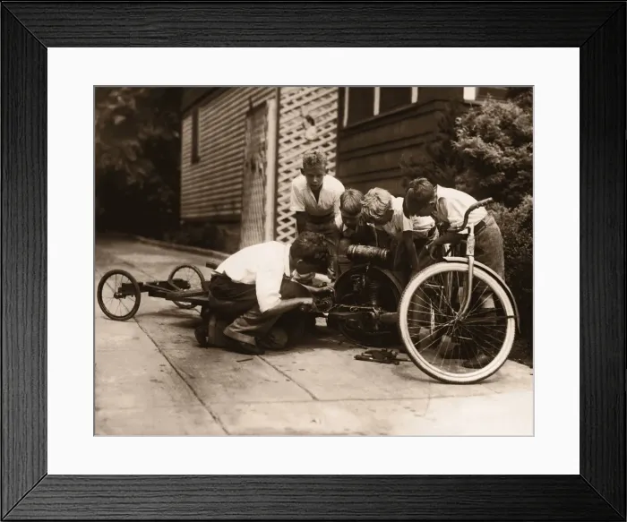 Framed Print : Four boys (10-13) building go-cart (B&W sepia tone) Framed Print : Four boys (10-13) building go-cart (B&W sepia tone)