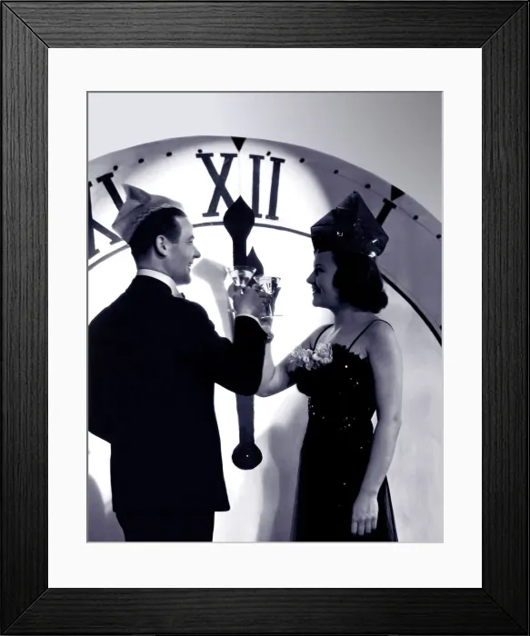 Framed Print : Couple in formal wear celebrating New Year (B&W) Framed Print : Couple in formal wear celebrating New Year (B&W)