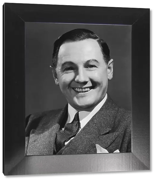 Man smiling, close-up, portrait (B&W)