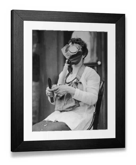 Framed Print : Woman peeling potato, wearing gas mask (B&W) Framed Print : Woman peeling potato, wearing gas mask (B&W)