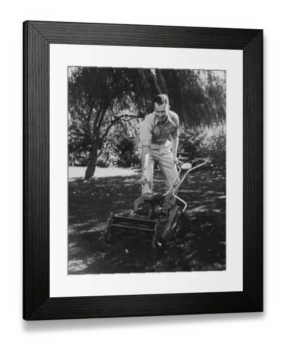 Framed Print : Man starting lawn mower (B&W) Framed Print : Man starting lawn mower (B&W)