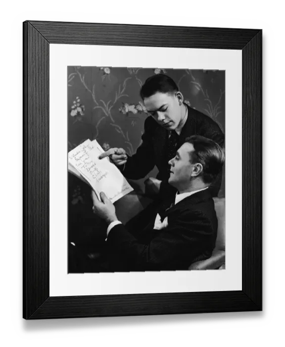 Framed Print : Father and teenage son (16-18) going over school budget (B&W) Framed Print : Father and teenage son (16-18) going over school budget (B&W)